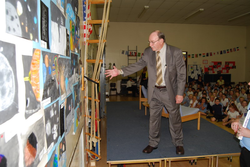 Apollo 14 Astronaut Dr Edgar Mitchell inspects paintings that children from a local school had done especially for him Image (©) Rick Mulheirn